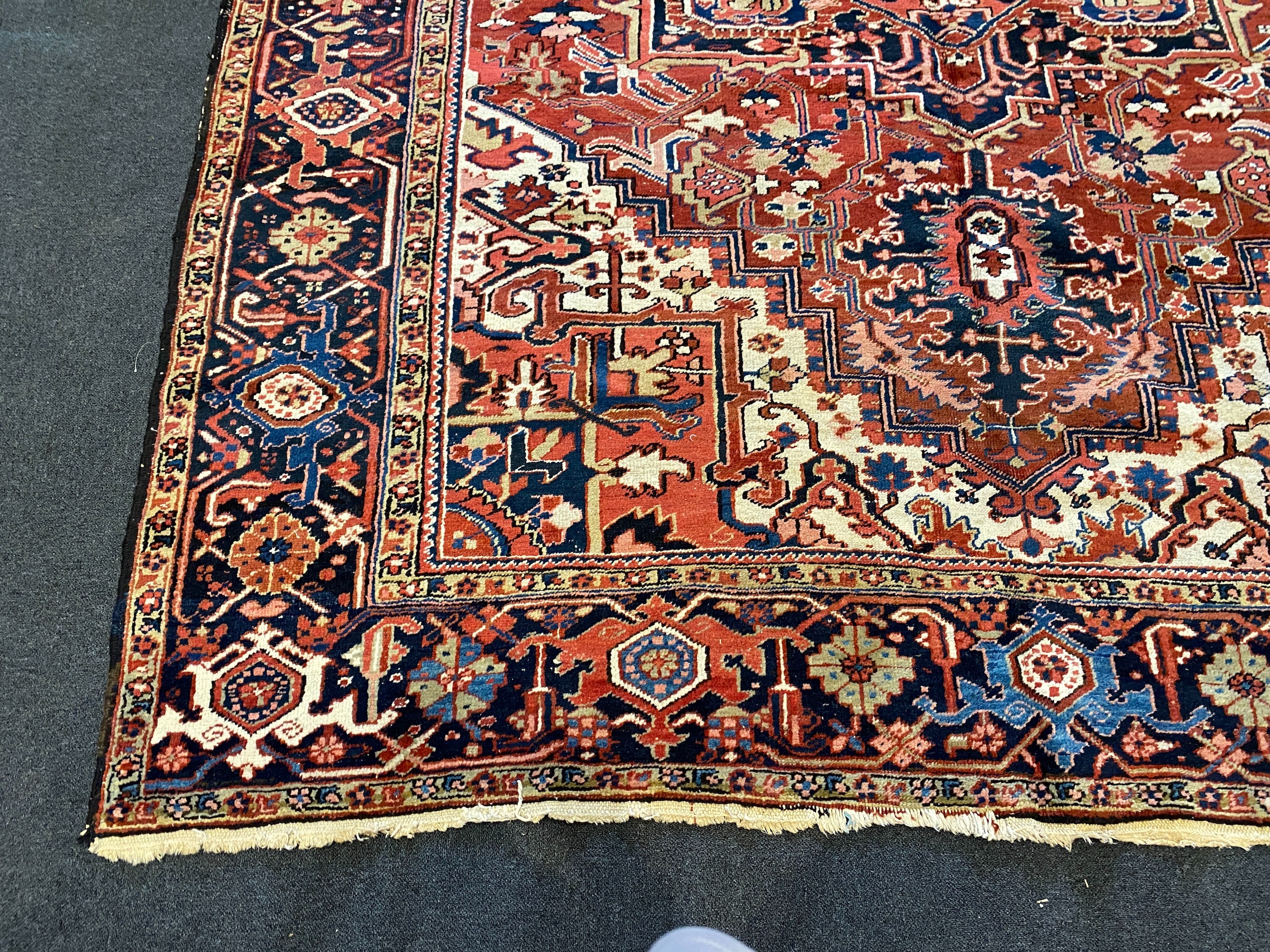 An Heriz red ground carpet, 364 x 265cm
